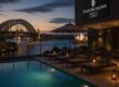 Rooftop pool at Four Seasons Hotel Sydney overlooking Sydney Harbour at sunset
