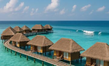 Overwater villas with surfers at Four Seasons Resort Maldives at Kuda Huraa