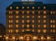Historic Hotel Adlon Kempinski facade illuminated at dusk in Berlin