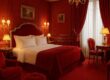 Designer room at Hôtel Plaza Athénée with bold red hues and elegant decor