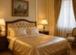 Luxurious silk sheets on a classic Hotel Sacher Wien bed
