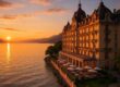Historic Hotel des Bergues overlooking Lake Geneva at sunset
