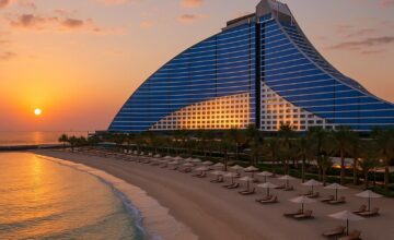 Jumeirah Beach Hotel iconic wave-shaped building at sunset