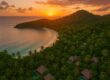 Aerial sunset view of Laucala Island Resort with villas and tropical landscape