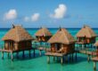 Likuliku Lagoon Resort overwater bure with turquoise water and traditional design