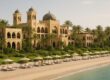 One&Only Royal Mirage resort beachfront with Arabian-style architecture and palm trees