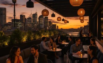 Panoramic rooftop view over Sydney skyline at sunset from QT Sydney