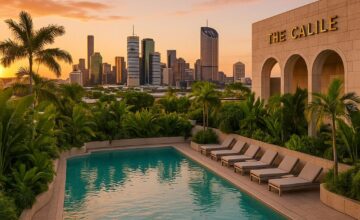 Rooftop pool at The Calile Hotel with Brisbane city skyline in background at golden hour