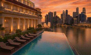 Rooftop infinity pool at The Fullerton Hotel Singapore with sunset view