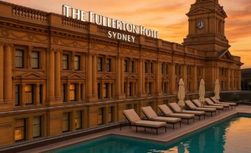 Rooftop pool at The Fullerton Hotel Sydney with historic building background