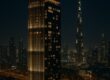 The Lana skyscraper glowing against the Dubai cityscape at dusk