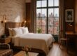 Stylish designer room at The Ludlow Hotel with warm wood accents and city view