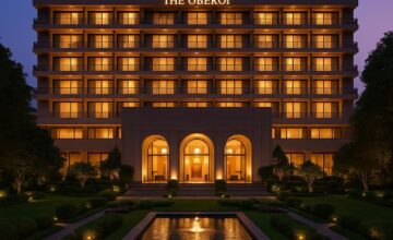 The Oberoi New Delhi illuminated at evening with landscaped gardens