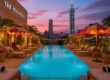 Infinity pool with Taipei skyline at The Peninsula Taipei, beach club atmosphere