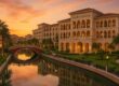 The Ritz-Carlton Abu Dhabi Grand Canal luxury hotel by picturesque canal at sunset