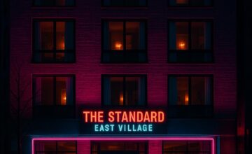 The Standard East Village hotel glowing with neon lights at night