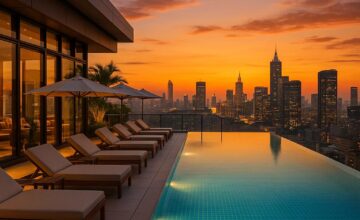 Rooftop pool with city skyline at sunset
