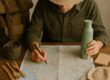 Traveler planning low-waste trip with reusable gear