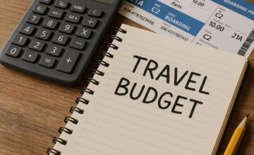 Person planning a travel budget with calculator and tickets