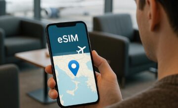 Traveler using smartphone with eSIM during international travel