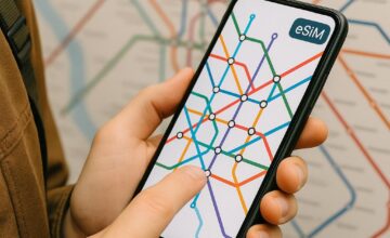 Traveler using smartphone with eSIM navigation