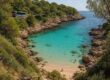 Scenic hidden swimming bay with calm turquoise waters and rocky shoreline
